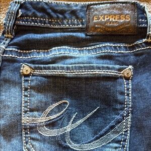 Express Blue Jeans with Decorative Stitching and Leather Patch